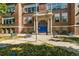 Classic brick school building with prominent entrance and well-maintained grounds at 1141 Adams St, Denver, CO 80206