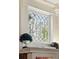 Close-up of a decorative window with elegant trim and design details at 1141 Adams St, Denver, CO 80206