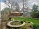 Landscaped backyard with flower beds and wooden fence at 7906 W Walker Dr, Littleton, CO 80123