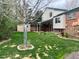The backyard features a lush lawn and a covered patio, perfect for outdoor enjoyment and entertaining at 7906 W Walker Dr, Littleton, CO 80123