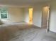 Light-filled bedroom with a view to ensuite, painted with neutral walls at 7906 W Walker Dr, Littleton, CO 80123