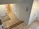 Landing featuring tile flooring, leading to various rooms at 7906 W Walker Dr, Littleton, CO 80123