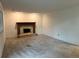 Empty living room featuring carpeting, a fireplace with a wooden mantel, and recessed lighting at 7906 W Walker Dr, Littleton, CO 80123