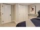 Bedroom with carpet, closet, and decor at 2568 Clermont St, Denver, CO 80207