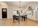 Bright dining room with modern light fixture and views to the front yard at 2568 Clermont St, Denver, CO 80207