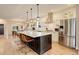 Modern kitchen with a large island, stainless steel appliances, and open layout at 2568 Clermont St, Denver, CO 80207