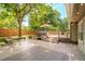 Large backyard deck with outdoor seating and ambient string lights, providing a perfect space for entertaining at 16438 E Prentice Cir, Centennial, CO 80015