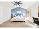 Inviting bedroom featuring a vaulted ceiling, large windows, and cozy decor at 16438 E Prentice Cir, Centennial, CO 80015
