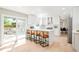 Modern kitchen featuring white cabinets, stainless steel appliances, quartz countertops, and a large kitchen island at 16438 E Prentice Cir, Centennial, CO 80015