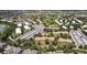 Aerial shot of residential neighborhood and golf course, featuring neatly arranged condos and green spaces with mature trees at 745 S Alton Way # 11A, Denver, CO 80247