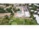 Aerial view of community featuring a pool, golf course, manicured landscaping, and ample parking at 745 S Alton Way # 11A, Denver, CO 80247