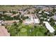 Aerial view of an apartment complex that includes a swimming pool and an adjacent golf course at 745 S Alton Way # 11A, Denver, CO 80247