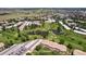 Aerial view of well-manicured lawns, mature trees, multiple lakes and ponds around the apartment complex at 745 S Alton Way # 11A, Denver, CO 80247