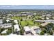 Overhead shot of community near Windsor Gardens with a swimming pool, golf course and various residential buildings and mature trees at 745 S Alton Way # 11A, Denver, CO 80247