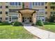 Exterior view of building entrance with covered walkway and well-manicured lawn at 745 S Alton Way # 11A, Denver, CO 80247