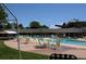 Outdoor swimming pool area with lounge chairs and tables, creating a relaxing and inviting atmosphere for residents at 745 S Alton Way # 11A, Denver, CO 80247