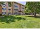 Exterior view of the apartment building, showcasing its well-maintained facade and landscaping at 745 S Alton Way # 11A, Denver, CO 80247