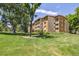 Attractive apartment building with lush landscaping, mature trees and well-maintained lawn at 745 S Alton Way # 11A, Denver, CO 80247