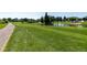 Lush green golf course with water features and manicured landscaping, showcasing the community's recreational amenities at 745 S Alton Way # 11A, Denver, CO 80247