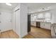 Modern kitchen with stainless steel appliances and a view to the living space at 745 S Alton Way # 11A, Denver, CO 80247