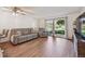 Cozy living room with new floors, modern furnishings, and a view of the outdoor area at 745 S Alton Way # 11A, Denver, CO 80247