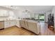 Open living space featuring new flooring, modern lighting, and sliding glass doors to a patio at 745 S Alton Way # 11A, Denver, CO 80247