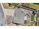 Bird's eye view of a home featuring a large driveway, landscaped backyard, and a well-manicured lawn at 3761 S Orleans St, Aurora, CO 80013