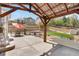 Scenic backyard featuring a covered patio with outdoor seating and a landscaped yard at 3761 S Orleans St, Aurora, CO 80013