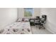 Bright bedroom showcasing a sleek desk setup, a black office chair, and carpet flooring at 3761 S Orleans St, Aurora, CO 80013