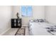 Bright bedroom featuring neutral walls, carpet flooring, and a large window at 3761 S Orleans St, Aurora, CO 80013