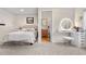 Cozy bedroom offering an adjacent vanity area and a full bathroom at 3761 S Orleans St, Aurora, CO 80013