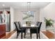 Elegant dining room featuring a modern chandelier, a marble table, and comfortable seating at 3761 S Orleans St, Aurora, CO 80013