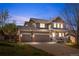 Charming home with a well-manicured lawn, three-car garage, and inviting front porch at 3761 S Orleans St, Aurora, CO 80013