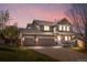 Inviting two-story home with a three-car garage and charming front porch, perfect for relaxing at 3761 S Orleans St, Aurora, CO 80013