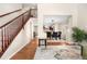 Open concept foyer leading to the dining room, showcasing hardwood floors and natural light at 3761 S Orleans St, Aurora, CO 80013