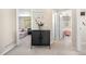 Hallway view with decor and doorways to two carpeted bedrooms with windows bringing in natural light at 3761 S Orleans St, Aurora, CO 80013