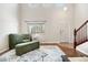 Cozy sitting area with a plush chair and view of the front yard, perfect for relaxing at 3761 S Orleans St, Aurora, CO 80013