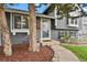 Charming home featuring a welcoming front entrance with meticulous landscaping and a cozy walkway at 5870 S Perth Pl, Centennial, CO 80015
