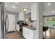 Well-lit kitchen featuring granite countertops and stainless steel appliances, connecting seamlessly to the outdoor space at 5870 S Perth Pl, Centennial, CO 80015
