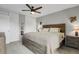 Spacious bedroom featuring a ceiling fan, wooden bed frame, closet and natural light at 5870 S Perth Pl, Centennial, CO 80015