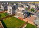 Aerial view of a home with a large backyard, patio, and solar panels in a residential neighborhood at 10071 Yampa Ct, Commerce City, CO 80022