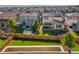 Aerial view of backyard with trampoline, lush lawn, and privacy fence at 10071 Yampa Ct, Commerce City, CO 80022