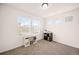 Cozy bedroom with carpeted floors, several windows, and storage space at 10071 Yampa Ct, Commerce City, CO 80022