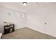 Bedroom features carpeted floors, multiple small windows, and a closet for ample storage at 10071 Yampa Ct, Commerce City, CO 80022