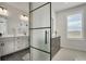 Elegant bathroom with modern vanity, sleek finishes, and a glass-enclosed shower creates a luxurious retreat at 14998 Cast Pebble Cir, Parker, CO 80134