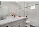 Well-lit bathroom featuring a single vanity, tub-shower combo, and contemporary fixtures for a modern appeal at 14998 Cast Pebble Cir, Parker, CO 80134