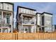 Modern townhome with a private balcony, fenced yard, and stylish curb appeal at 14998 Cast Pebble Cir, Parker, CO 80134