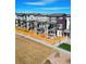 Modern townhome community with multiple units, fenced yards, and attractive landscaping on a bright day at 14998 Cast Pebble Cir, Parker, CO 80134