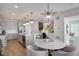 Well-lit kitchen features a central island, modern stainless steel appliances, and a dining area perfect for entertaining at 14998 Cast Pebble Cir, Parker, CO 80134