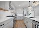 Modern kitchen features stainless steel appliances, white subway tile backsplash, and ample countertop space at 14998 Cast Pebble Cir, Parker, CO 80134